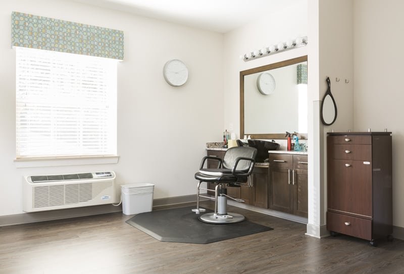 Salon chair in front of mirror